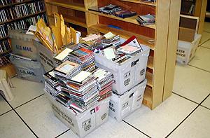 Piles of incoming CDs